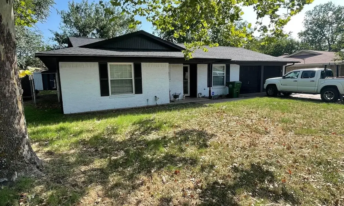 Professional roofing crew working on a residential roof in Gunnison